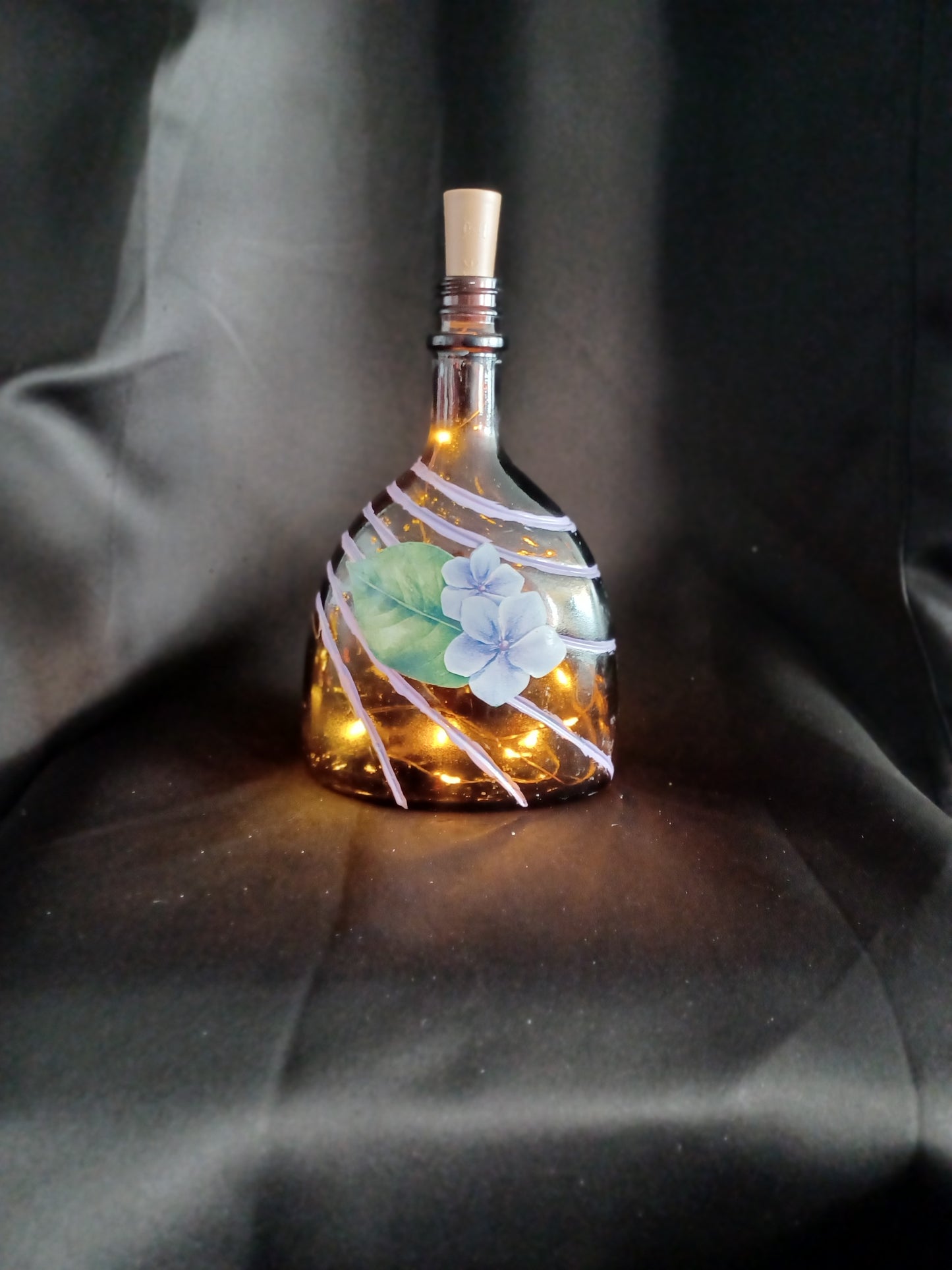 Hand painted Lg glass bottle w/ purple, yellow flower & stripes w/ fairy lights