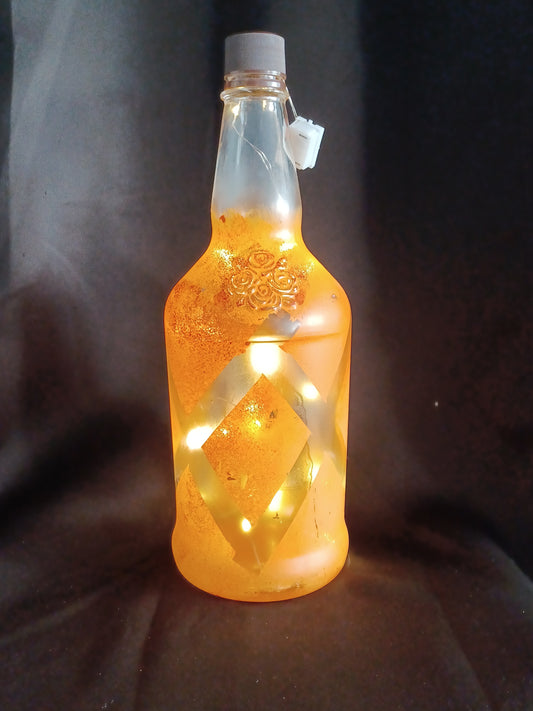 Hand painted lg bottle w/ orange diamond pattern, roses and fairy lights