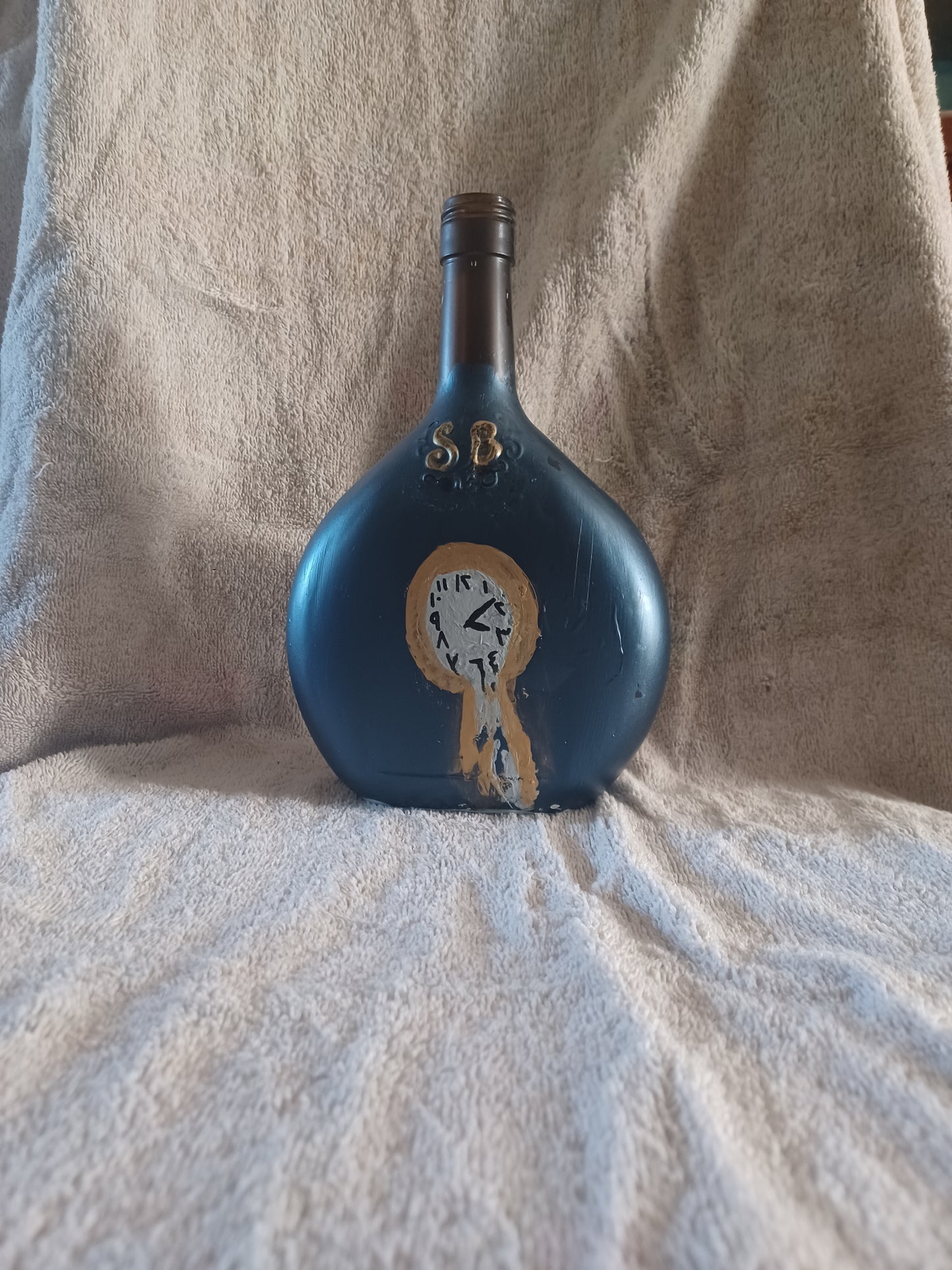 Hand painted lg bottle w/ melting clock & fairy lights