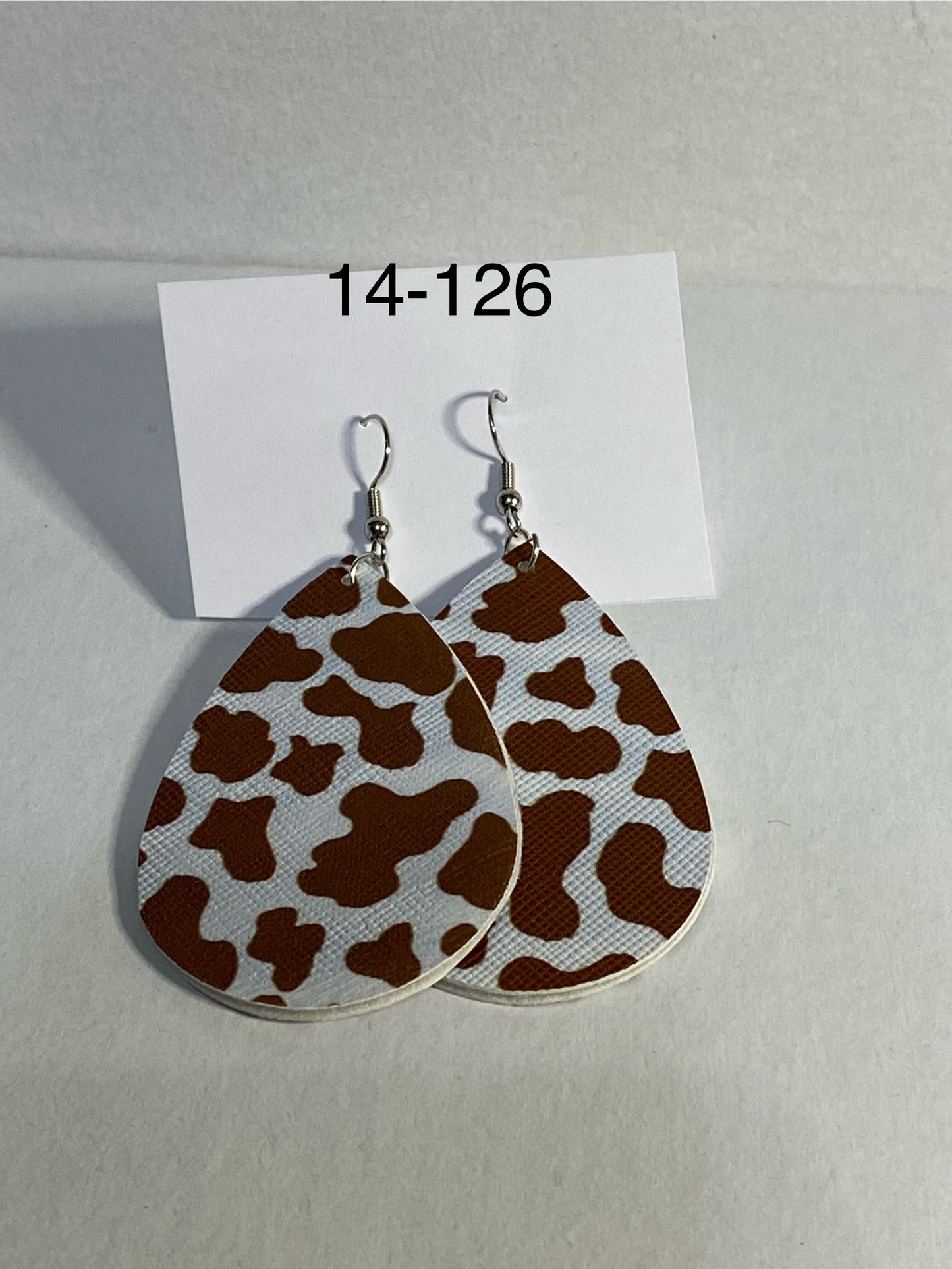 brown cow print faux leather earrings