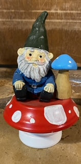 Gnome with a mushroom on a mushroom