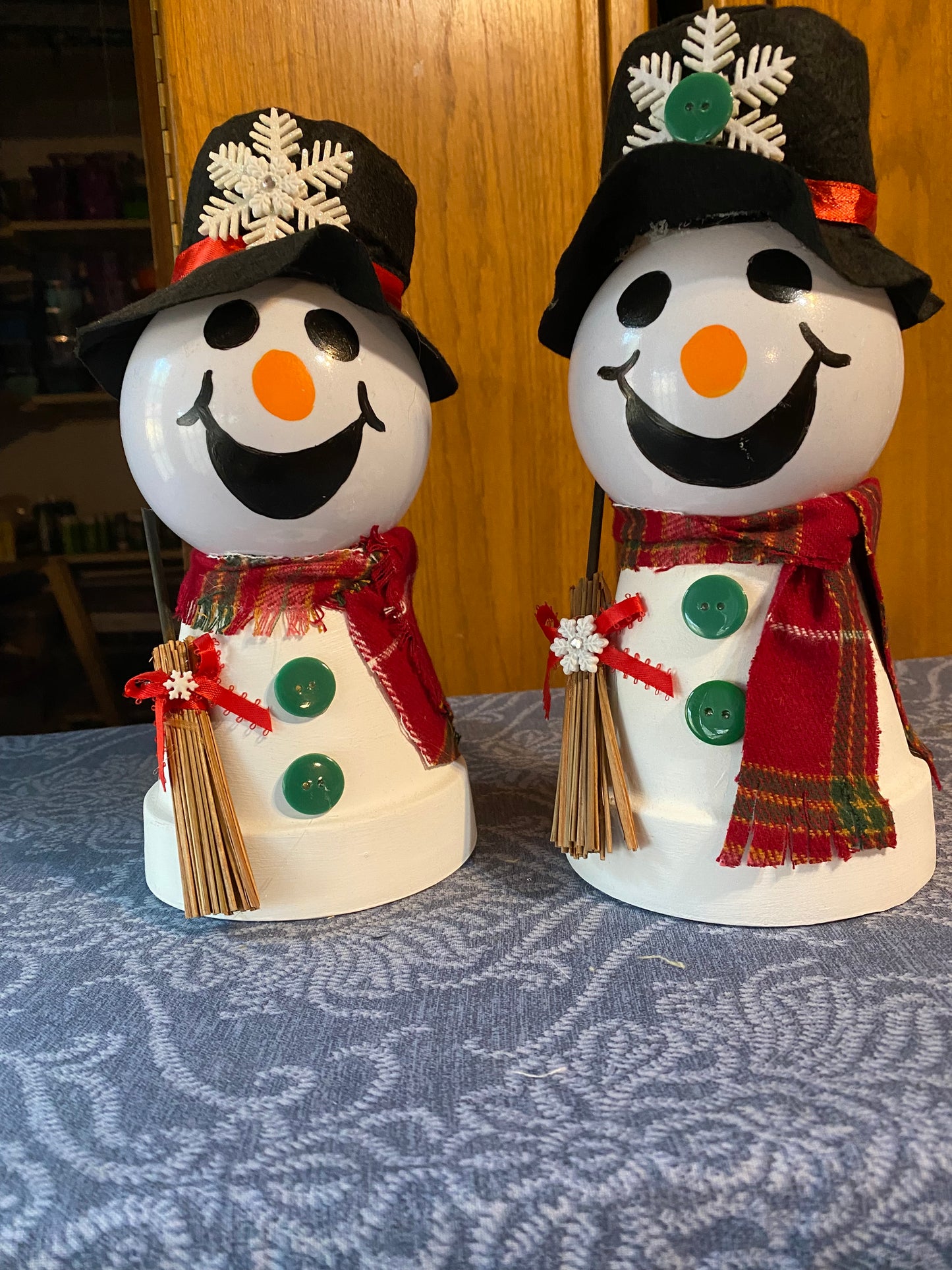 Snowman with hat and broom